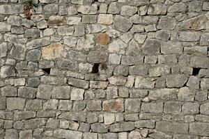 texture Stones and cement masonry walls. photo