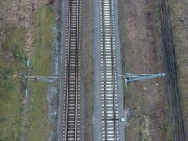 Plot railway. Top view on the rails. High-voltage power lines for electric trains photo