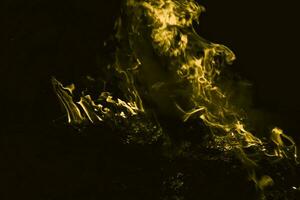 Yellow flame. Burning of rice straw at night. photo