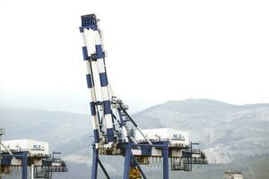 The international sea port of Novorossiysk. Port cranes and industrial objects. Marine Station. photo