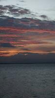 Vertical video of a Beautiful view of the sunset on a summer day. lake sunset