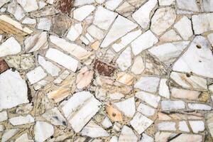 Texture background of stone floor. Pieces of marble in cement. photo