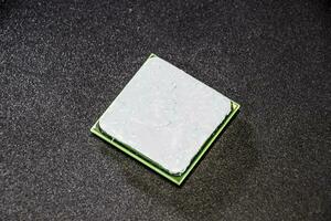 The processor of the computer with the thermal paste applied on it. Details of the computer's system unit. photo
