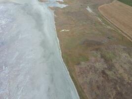 Saline Salt Lake in the Azov Sea coast. Former estuary. View from above. Dry lake. View of the salt lake with a bird's eye view photo