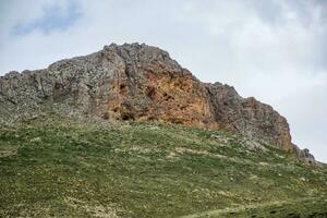 Caves in the limestone mountains. Void in rock mountain. photo