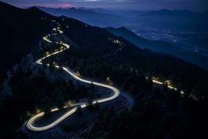 AI generated Curvy mountain road with trailing lights at night photo