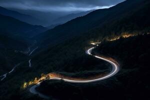 AI generated Curvy mountain road with trailing lights at night photo