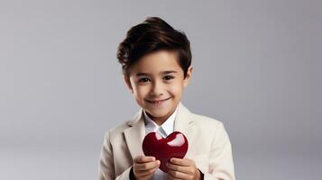 ai generado retrato de un linda pequeño niña participación un rojo corazón en un gris antecedentes foto