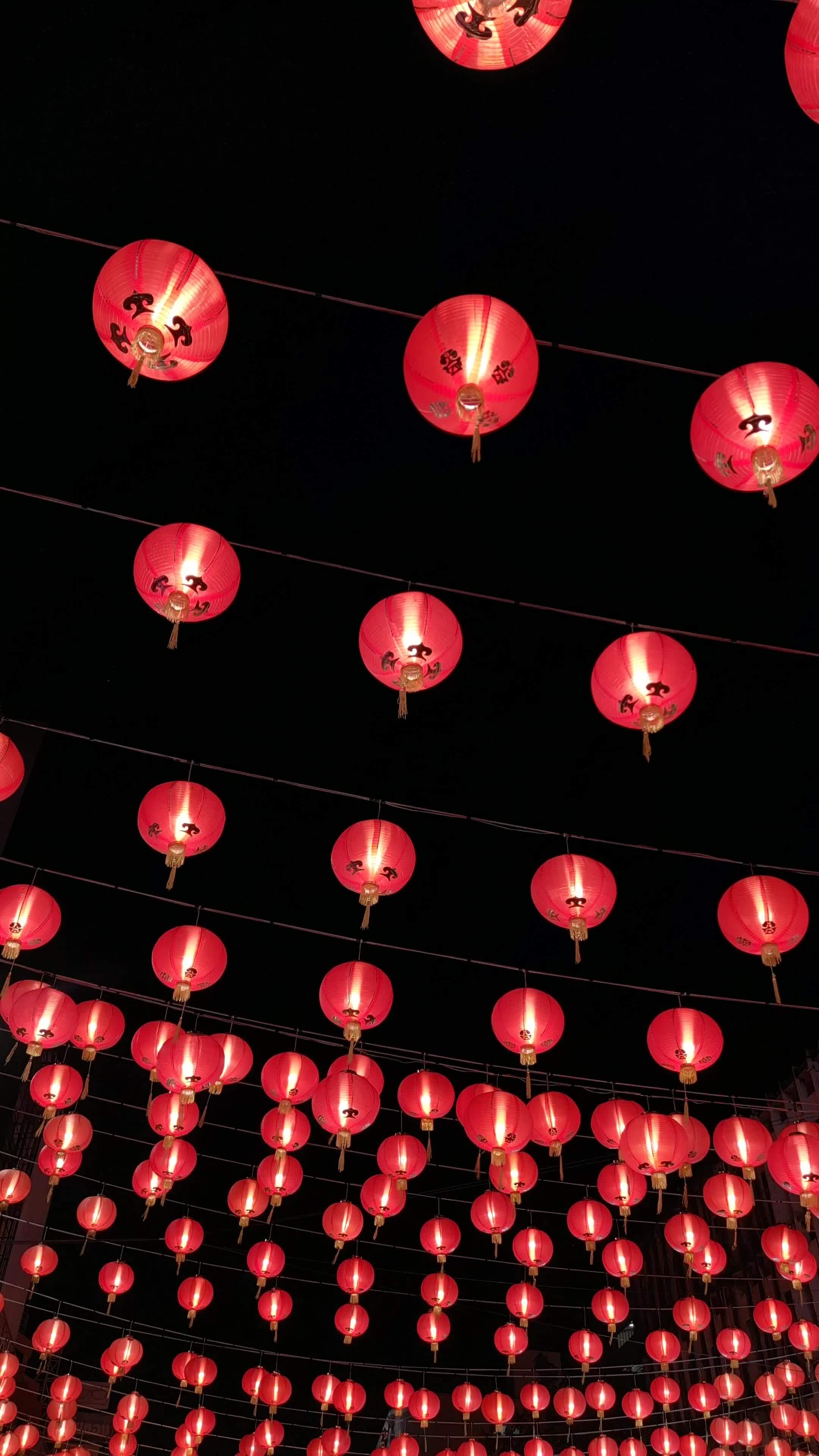 Chinese red lanterns symbolize wealth and happiness at night. Lunar New