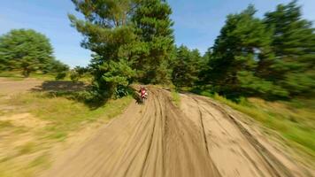 FPV of High-Speed Motocross Bike On Track Aerial video