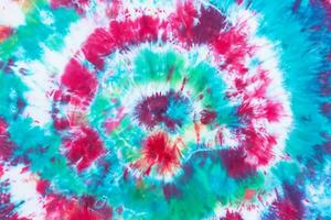 tie dye pattern hand dyed on cotton fabric abstract texture background. photo