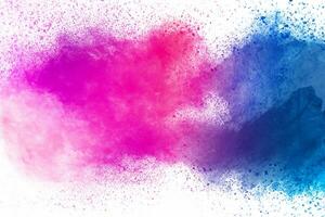 Colorful background of pastel powder explosion.Color dust splash on white background. photo