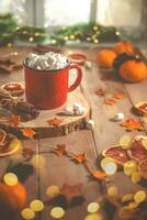 Cute cozy winter composition. red mug, marshmallows, oranges and Christmas lights. photo