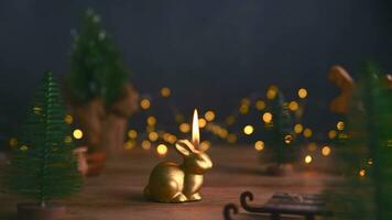 a candle burns in the form of a rabbit, a symbol of 2023 photo