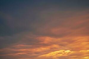 beautiful orange dramatic clouds at sunset photo