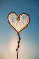 concept winter, frost. beautiful frosty patterns on a heart shape, soap bubbles, freezing photo