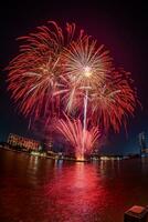 fireworks on the river in the dark sky photo