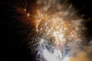 fireworks on the river in the dark sky photo