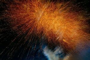 fireworks on the river in the dark sky photo