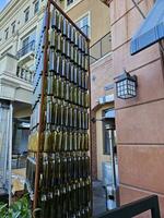 Wine bottles arranged vertically in a pattern as a work of art in Napa California photo