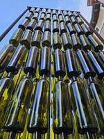 Wine bottles arranged vertically in a pattern as a work of art in Napa California photo