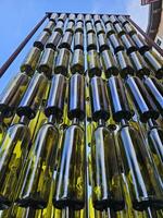 Wine bottles arranged vertically in a pattern as a work of art in Napa California photo