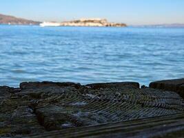 View of Alcatraz Island from Fort Mason port in San Francisco California photo