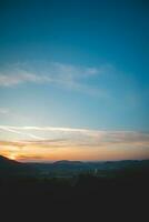 Colourful sky during sunset with reddish hues. Blue, orange and golden sky. Abstract sky photo