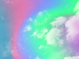 beauty abstract sweet pastel soft green and pink with fluffy clouds on sky. multi color rainbow image. fantasy growing light photo