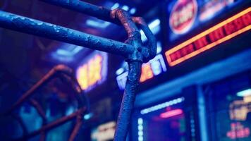 A close up of a metal fence with neon lights in the background video