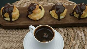 profiterole and coffee. High quality 4k footage video