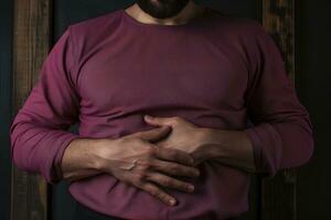 AI generated Man lies and holding his aching stomach photo