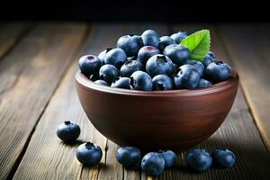 AI generated Fresh blueberries in a bowl on a wooden background, Blueberry banner. Bowl full of blueberries. Close-up food photography background Ai generated photo