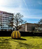 Washington DC, US - 12.16.2023 Close up of iconic yellow pumpkin by artist Yayoi Kusama in the Hirshhorn Museum and Sculpture Garden photo