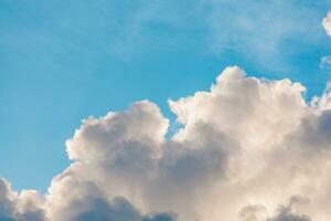 various shapes of clouds on different levels of blue background photo