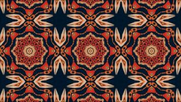 The animated kaleidoscope background with bright orange geometric abstract shapes on a dark blue background. video