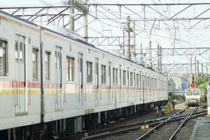 commuter line at the departure station. railway with train photography photo