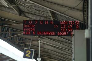 Digital train arrival information board in Indonesia photo