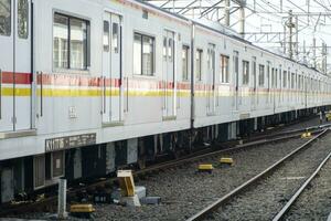 commuter line at the departure station. railway with train photography photo