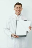 Practitioner man clinical healthcare doctor holding medic profession clipboard man person uniform photo