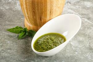 Homemade vegetarian basil pesto sauce photo