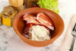 Salad with sliced tomato and stracciatella photo