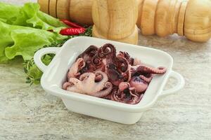 Marinated baby octopus seafood in the bowl photo