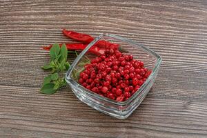 Red pepper seeds in the bowl photo