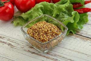 Mustard seeds sauce in the bowl photo