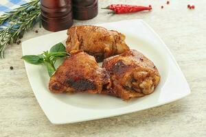 Roasted chicken leg with spicy sauce photo