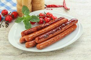 Roasted sausages in the plate photo