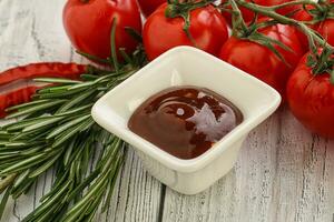 Tomato barbecue sauce on the bowl photo