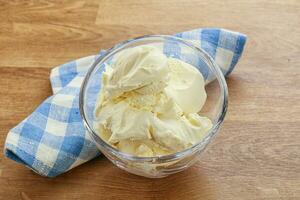 Italian soft mascarpone cheese in the bowl photo