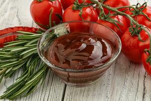 Tomato barbecue sauce on the bowl photo
